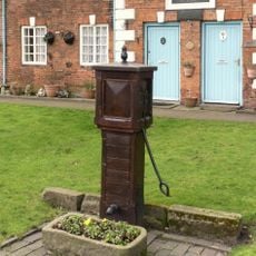 Hand Pump Approximately 10M East Of The Almshouses