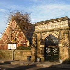 Stone Gateway And Attached Wall At Entrance To Memorial Gardens