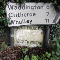 Guidestone, ExYW Lees, E of River Hodder, behind modern road sign