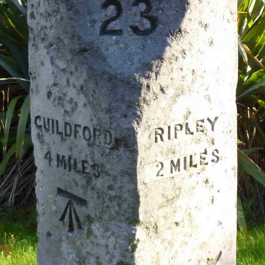 Milestone, Portsmouth Road, by Conaught House NE of petrol station and traffic island