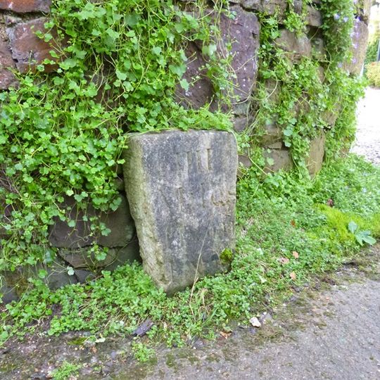 Milestone, by "The Cottage", 200m S of arch bridge and Haldon Drive to Lord Haldon Country Hotel