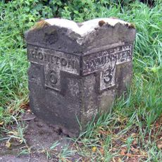 Milestone, 200m S of Lobelia House