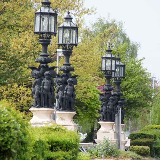 Four lamp standards with lanterns outside the main entrance to the Gillette Factory on the corner of Syon Lane
