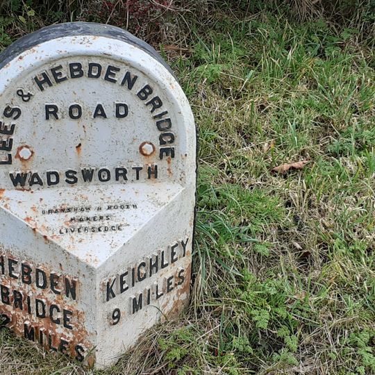 Milestone opposite junction with Crimsworth Lane