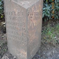 Milepost, NW of old windmill, W of Cuckoo Lane jct