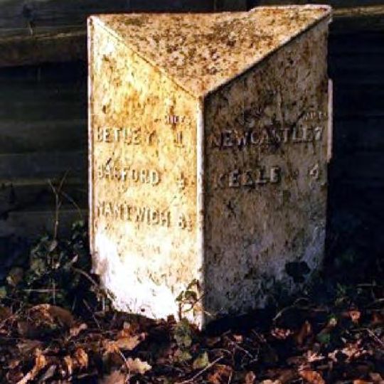 Milepost 50 Metres South Of The Hand And Trumpet Public House