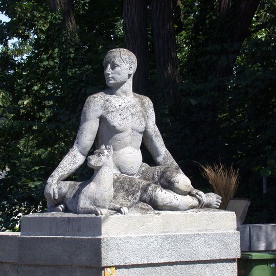 Männliche Figur mit Hund