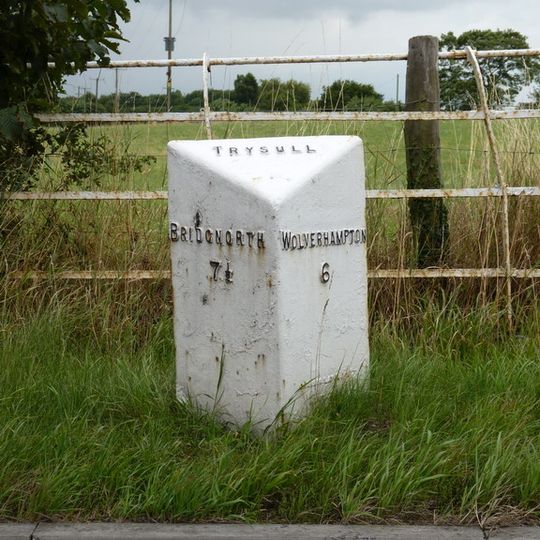 Milepost, E of Fox Road jct, opp public house car Park