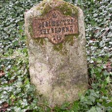 Milestone, half mile N of Charminster; 75m S of house called 'Leap Gate'.