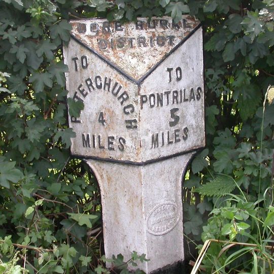 Milepost, Morehampton Park; 140m N Farmhouse Farm entrance