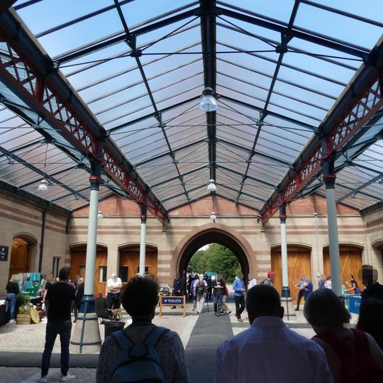 Coach House Court north of Stable Court with riding school and yard walls