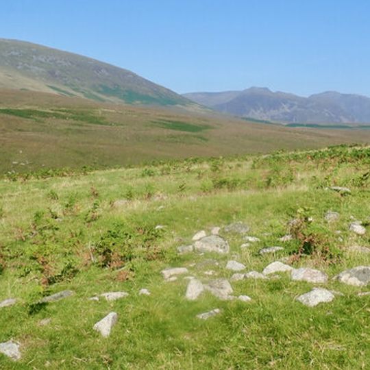 Prehistoric enclosure, hut circle and adjacent cairnfield east of Whillan Beck, Burnmoor