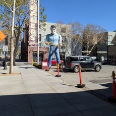 Man holding a muffler