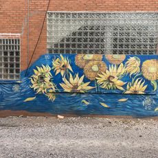 A mural depicting sunflowers in a style that is very similar to Vincent van Gogh's Starry Night