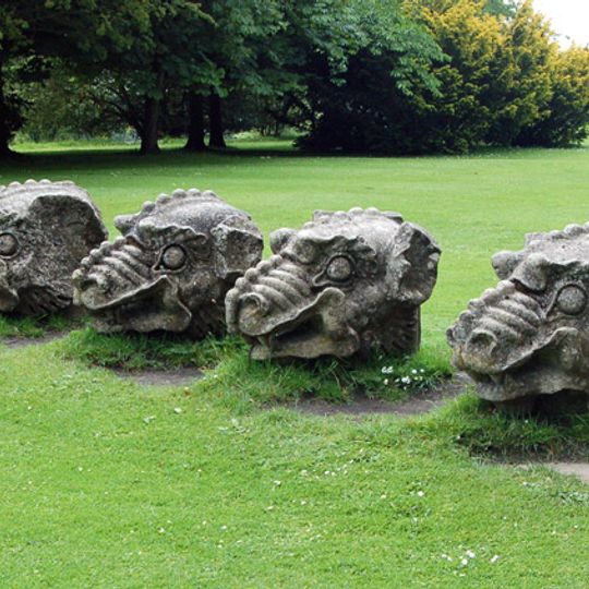 4 Stone Dragons Heads On Lawn East Of Hall