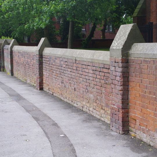 Wall to the west and south of Church of St Elizabeth
