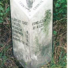 Milepost, S of Church