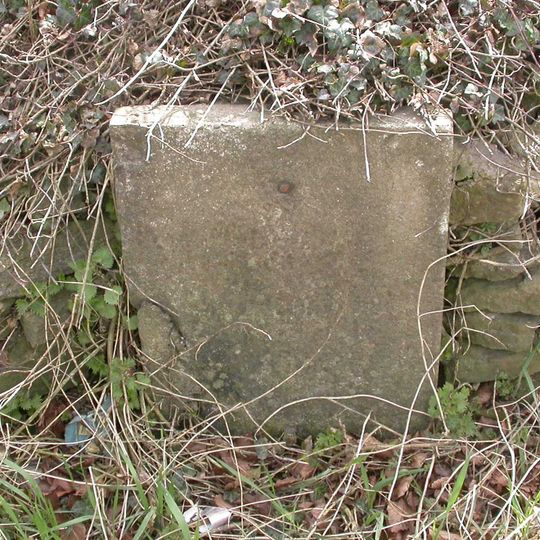 Milestone, The Folly; opp. pub car park