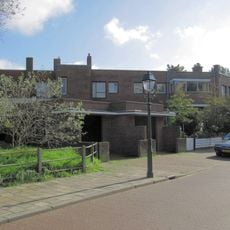 Woningblok van vier aaneengebouwde herenhuizen