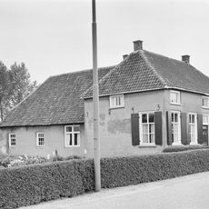 Gepleisterde boerderij op T-vormige plattegrond