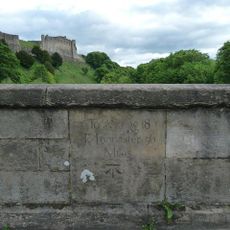 Milestone, on bridge over R Swale, just S of town