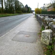Milestone Adjacent To House Known As 'Milestone'