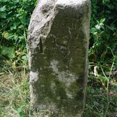 Milestone, E of vilage nr double bend
