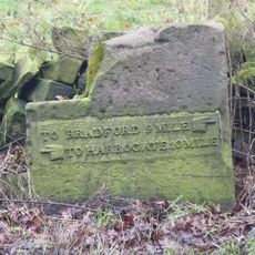 Milestone, Harrogate Road, just SW of jct with A660  at SE24074397