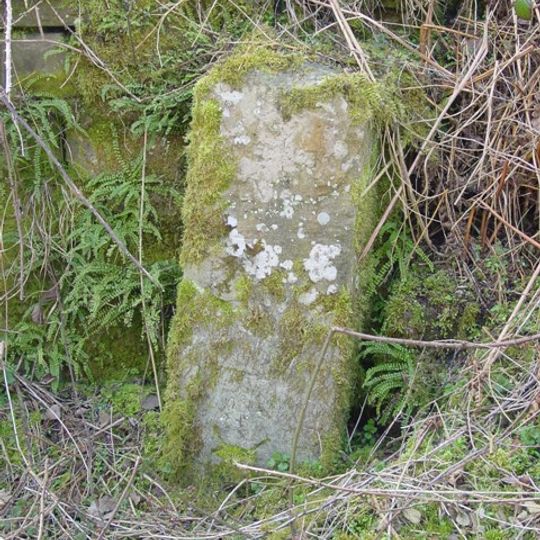 Milestone, by wall