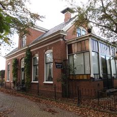 Winkelwoning met eclectische invloeden