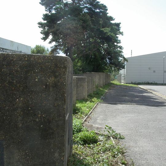 World War II pillbox and tank traps in former railway yard N of town