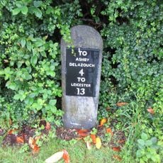 Milestone outside Ravenstone Village Institute