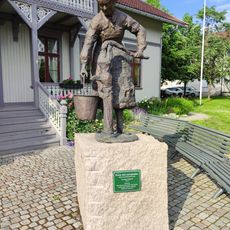 Kona ved vannposten