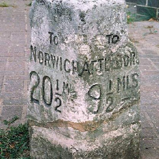 Milestone, 5yds E of Griston Rd in front of office/shop