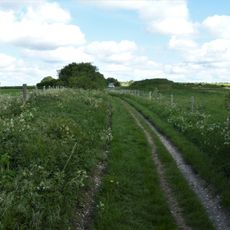 Bowl barrow 50m south of The Sanctuary on Overton Hill, forming part of the Seven Barrow Hill round barrow cemetery
