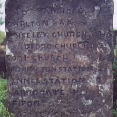 Milestone, Harrogate Road, just SW of jct with A660  at SE24114399