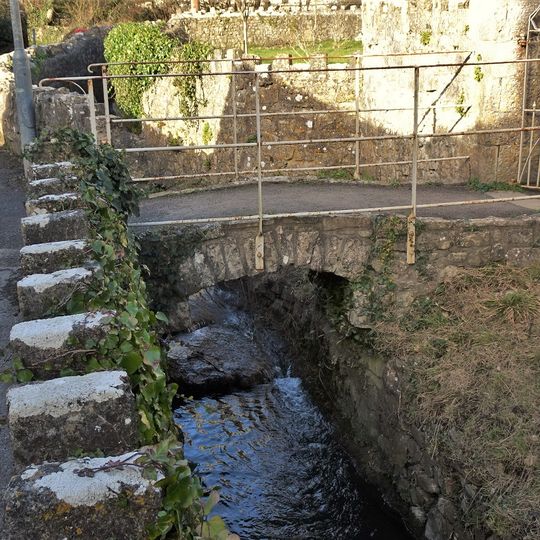 Footbridge over brook at West entrance to churchyard of Church of St Illtud