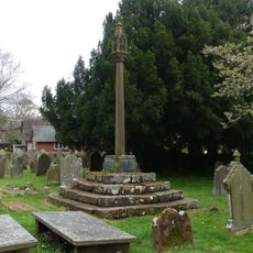 Cross and stepped base east of path to south porch of Church of St John the Baptist