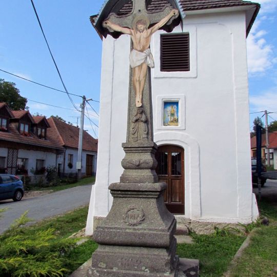 Cross in front of the bell tower in Přeckov