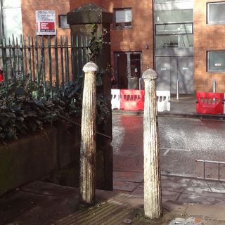 Two Bollards At West End Of St Johns Passage