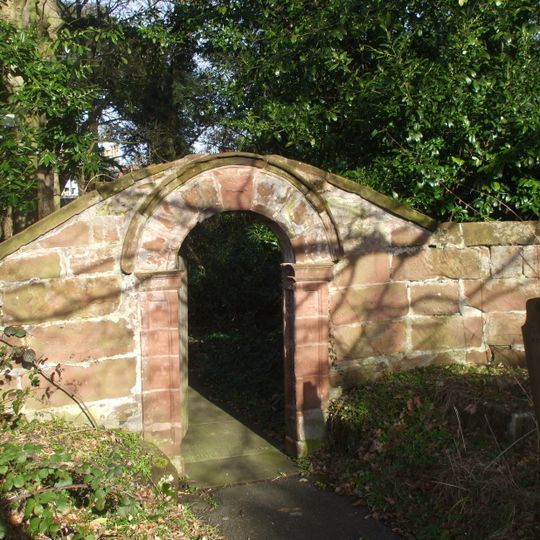 Churchyard walls and gateway to church of St Oswald