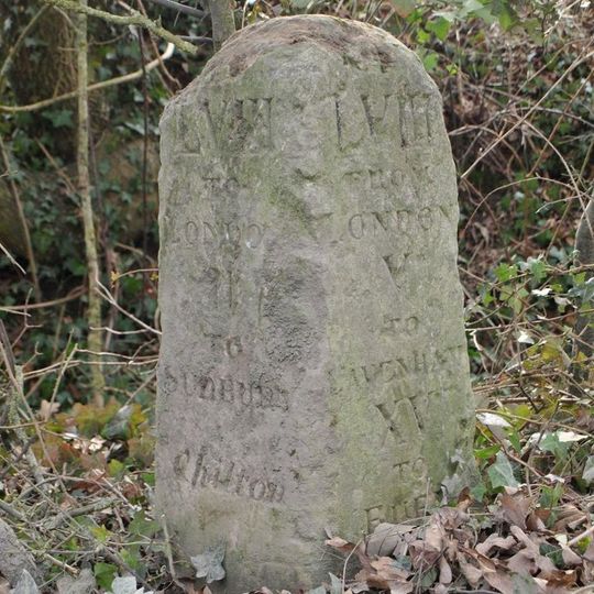 Milestone, Chilton Grove, just W of entrance to airfield