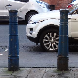 Two Bollards At East End Of St Johns Passage