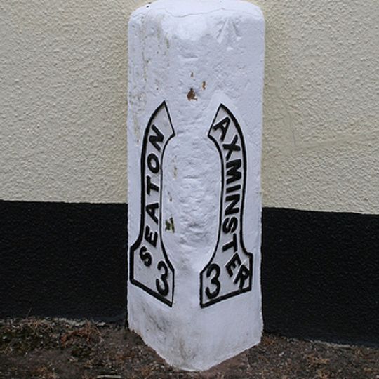 Milestone, Axminster Road, by Mountfield Lodge, on the old section of road through the village