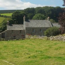 Lower Natsworthy Farmhouse, Including Cottage To Left And Outbuilding To Right