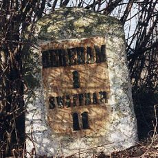Milestone, rear of layby opp. village sign