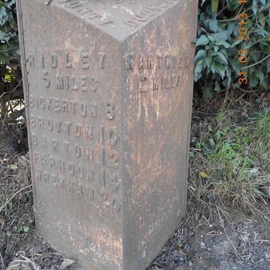 Milepost, NW of old windmill, W of Cuckoo Lane jct
