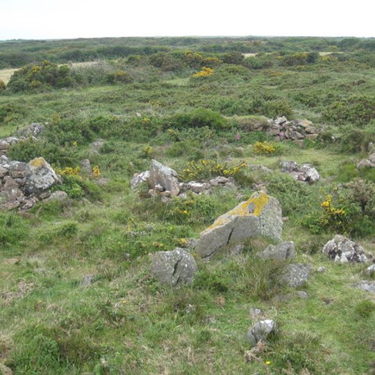 Stone hut circle settlement with irregular aggregate field system at Kynance Gate, 935m south east of Kynance Farm