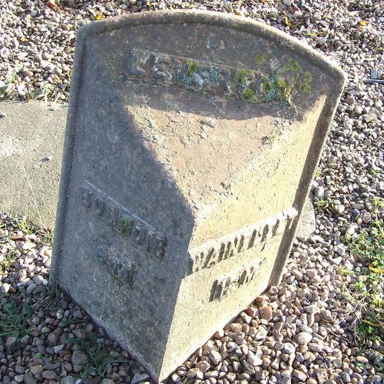 Mile Post In Centre Of Village