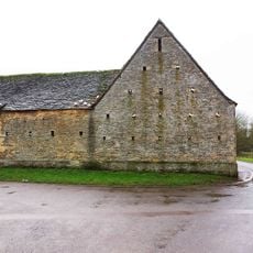 Barn range and attached walls, granary, outbuildings and stables approximately 50 metres north north east of Manor Farmhouse